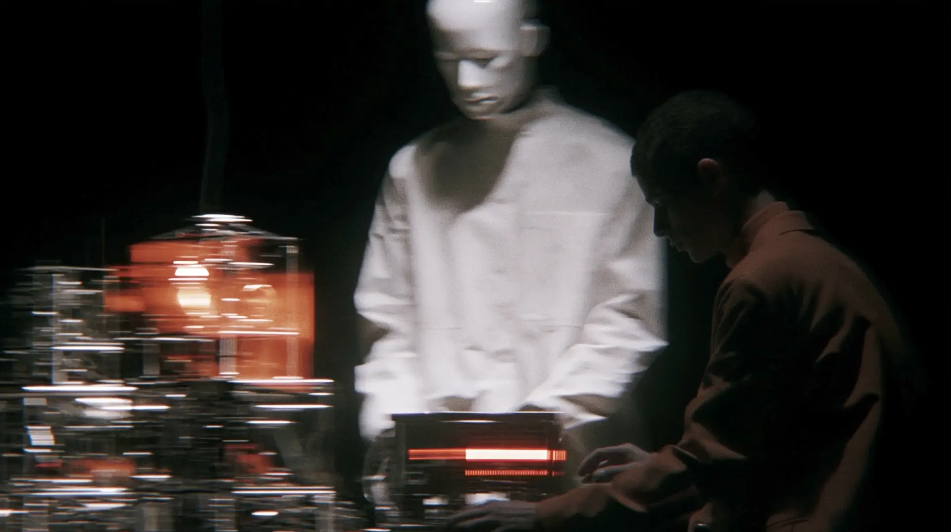 Futuristic android figure in a high-contrast dark environment